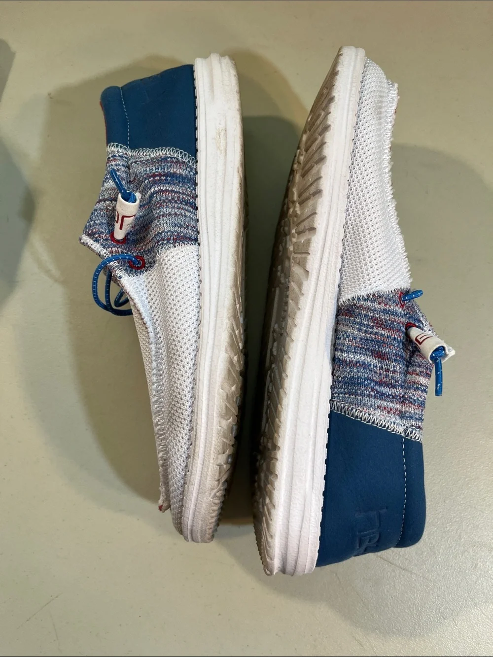 Hey Dude Men’s Slip-On Loafers in White with Blue and Red Accents